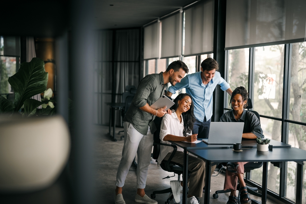 team looking at a computer